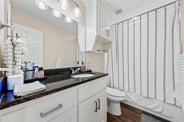 full bathroom featuring shower / tub combo, vanity, toilet, and wood-type flooring