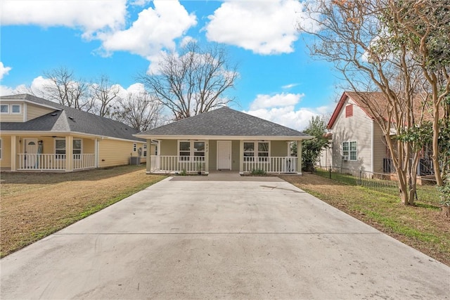 view of front of property with covered porch and a front yard