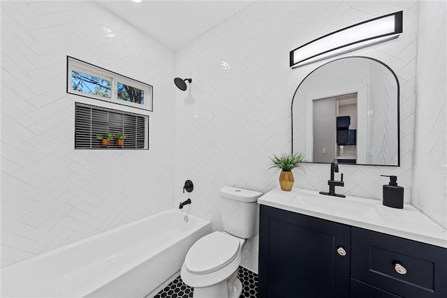 full bathroom with vanity, backsplash, tiled shower / bath combo, toilet, and tile walls