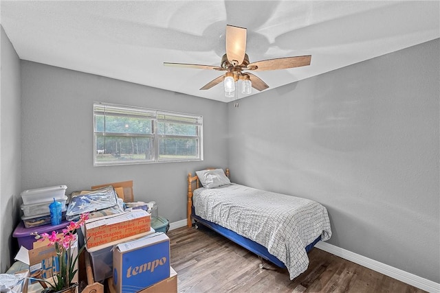 bedroom featuring ceiling fan and hardwood / wood-style floors