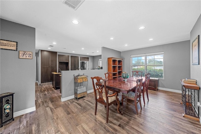 dining space featuring hardwood / wood-style flooring