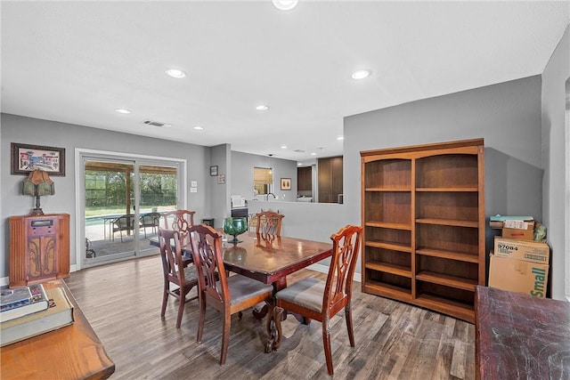 dining area with wood-type flooring