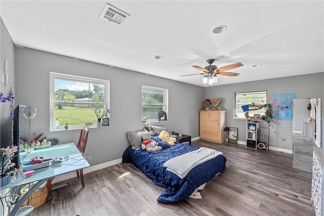 bedroom with hardwood / wood-style flooring and ceiling fan