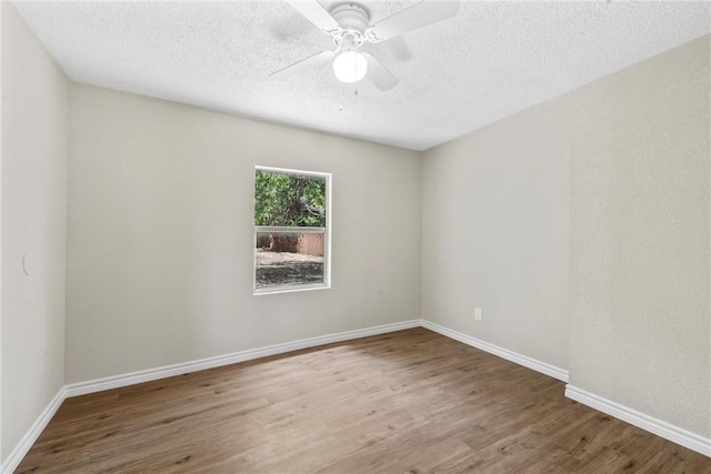 spare room featuring hardwood / wood-style floors, a textured ceiling, and ceiling fan