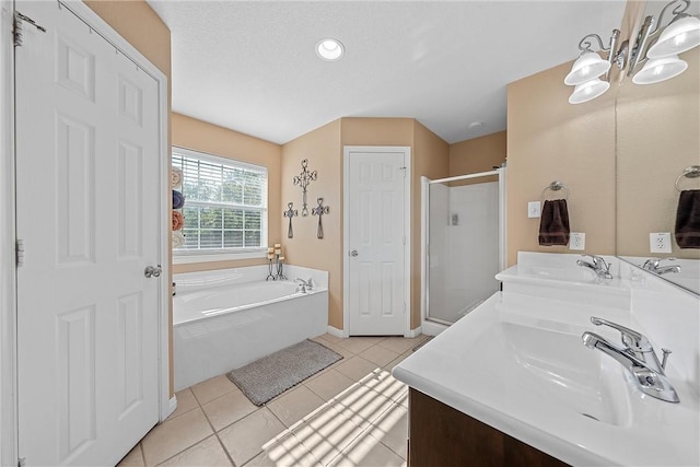 bathroom with tile patterned floors, separate shower and tub, vanity, and an inviting chandelier