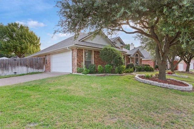 view of front facade featuring a front yard and a garage