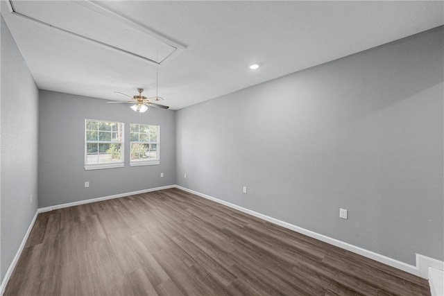 spare room with wood-type flooring and ceiling fan