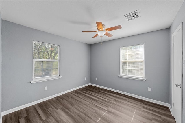 empty room featuring ceiling fan and hardwood / wood-style flooring