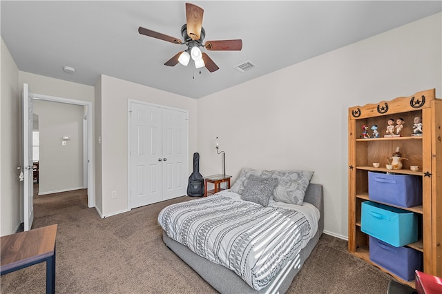 carpeted bedroom with ceiling fan and a closet