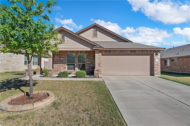 view of front of home with a garage and a front yard