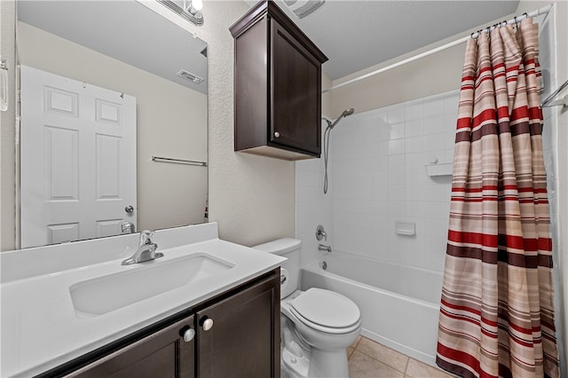 full bathroom with tile patterned flooring, shower / bath combination with curtain, a textured ceiling, toilet, and vanity