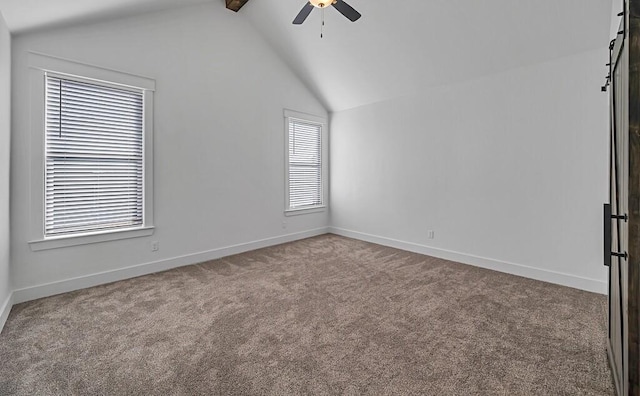 unfurnished room with carpet flooring, vaulted ceiling with beams, and ceiling fan