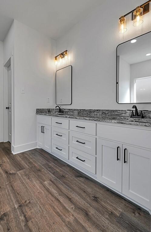 bathroom featuring hardwood / wood-style floors and vanity