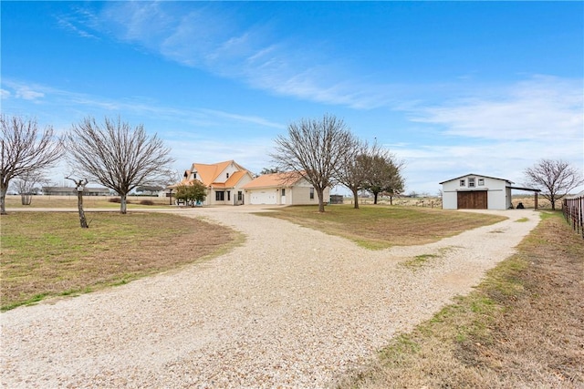 view of front of house with a front yard and a garage