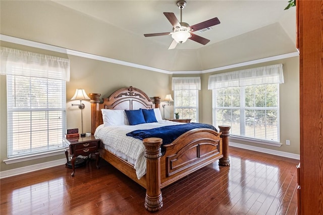 bedroom featuring ornamental molding, lofted ceiling, ceiling fan, and dark wood-type flooring