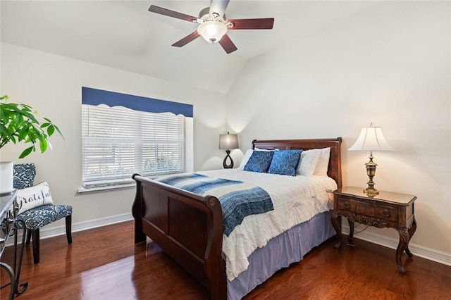 bedroom featuring ceiling fan, dark wood-type flooring, and lofted ceiling