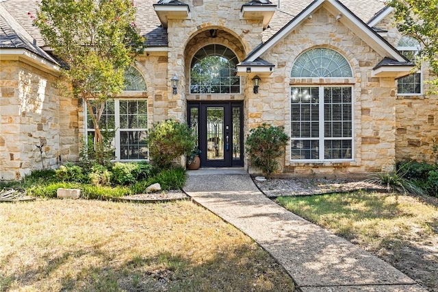 property entrance featuring french doors