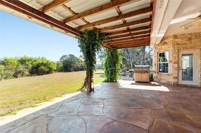 view of patio / terrace featuring a grill and ceiling fan