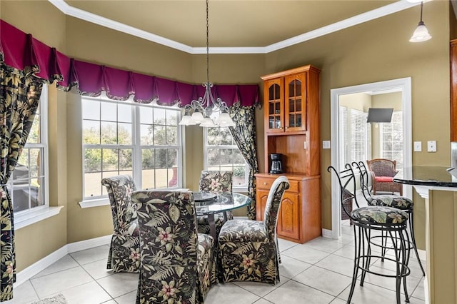 dining area with light tile patterned floors, crown molding, and a chandelier