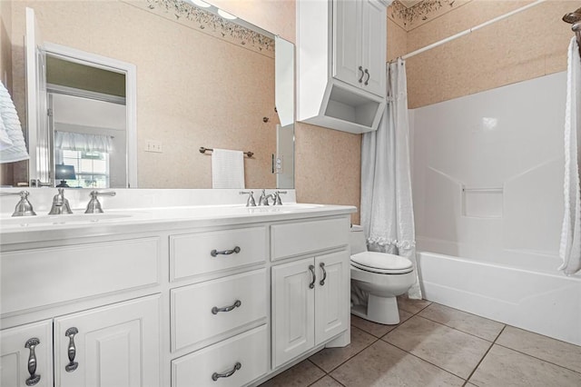 full bathroom with tile patterned flooring, shower / bath combo, toilet, and vanity