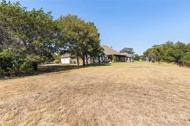 view of yard featuring a garage