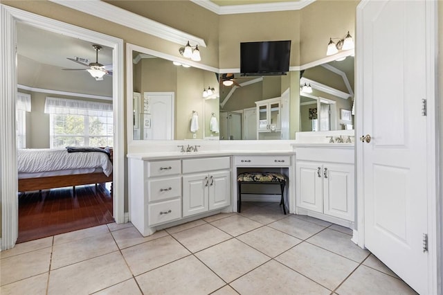 bathroom featuring tile patterned flooring, vanity, ceiling fan, and ornamental molding