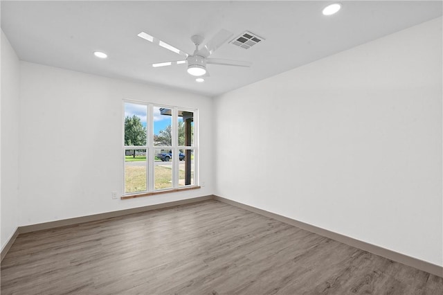 unfurnished room featuring ceiling fan and wood-type flooring