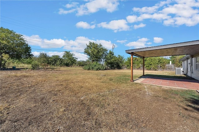 view of yard with central AC unit