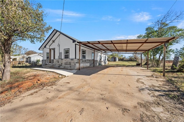 view of side of home featuring a carport