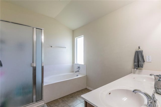 bathroom featuring tile patterned floors, vanity, lofted ceiling, and independent shower and bath