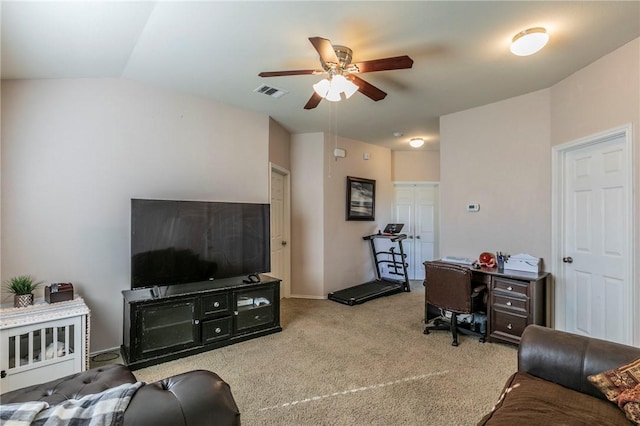 carpeted living room featuring ceiling fan and vaulted ceiling