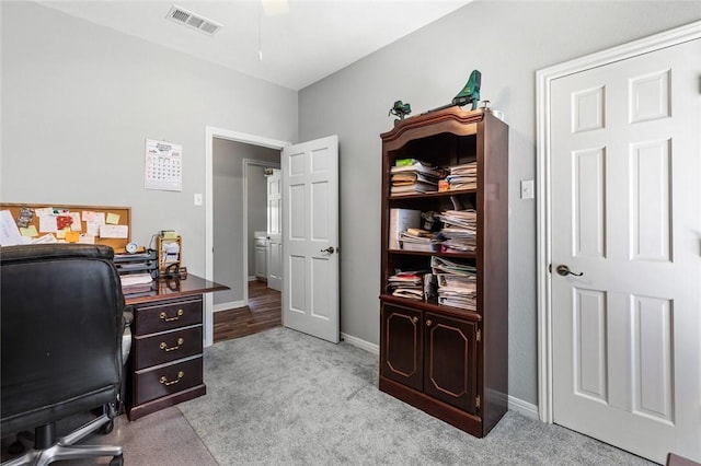 home office with light colored carpet