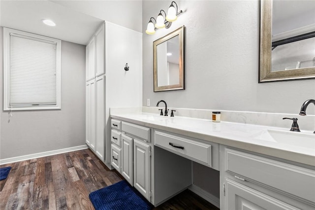 bathroom featuring vanity and wood-type flooring