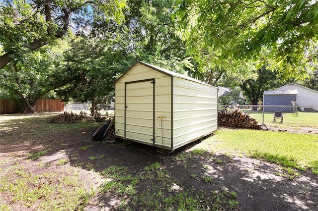 view of outdoor structure featuring a yard