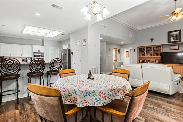 dining room featuring crown molding, dark wood-type flooring, and ceiling fan with notable chandelier