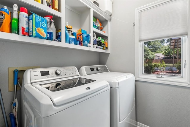 laundry room with independent washer and dryer