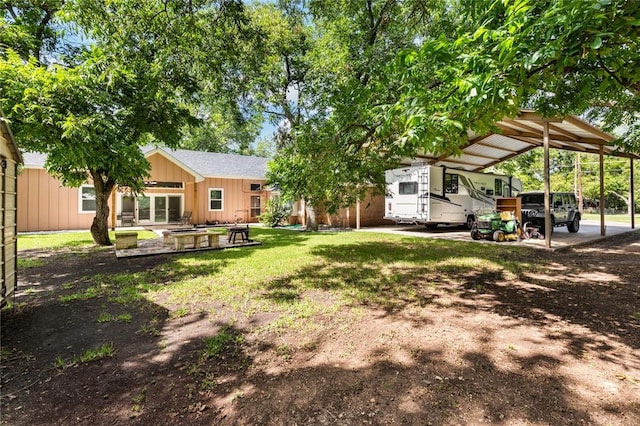 view of yard featuring a carport