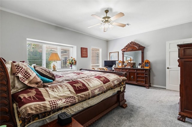 bedroom featuring crown molding, light colored carpet, and ceiling fan