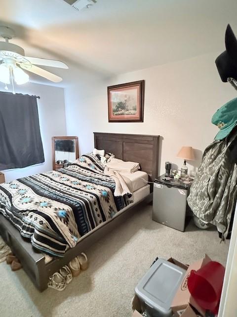 carpeted bedroom featuring ceiling fan