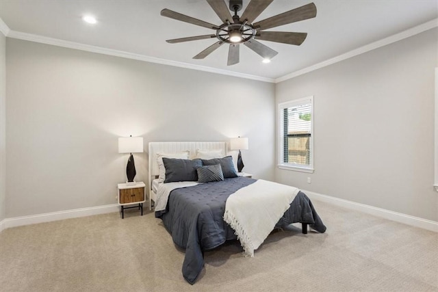 carpeted bedroom featuring ceiling fan and ornamental molding