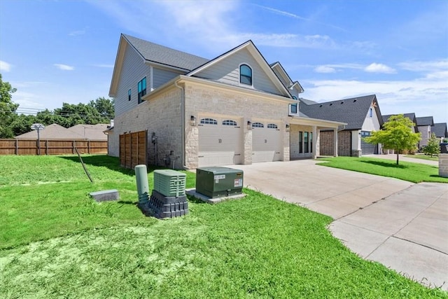 view of front of home featuring a front yard and a garage