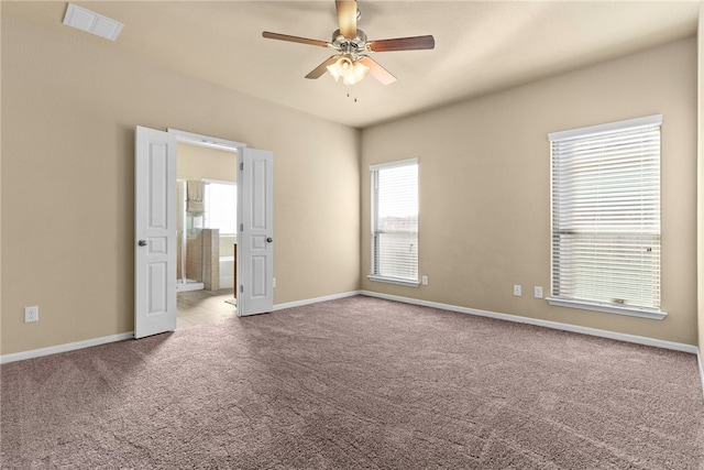 empty room featuring light carpet and ceiling fan