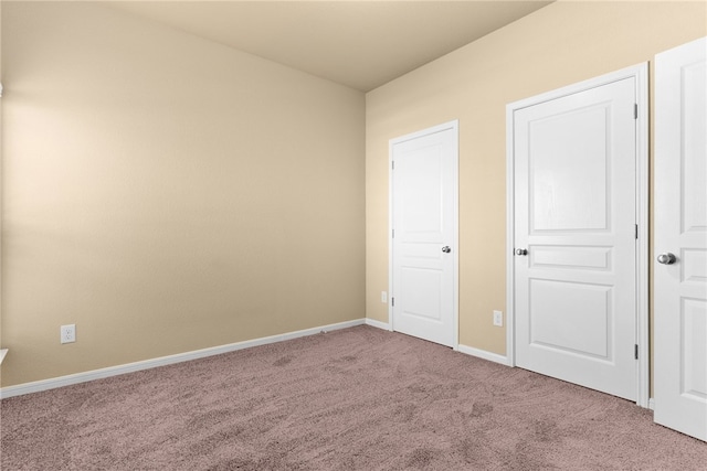 unfurnished bedroom with carpet floors