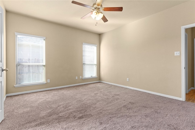 empty room featuring light carpet and ceiling fan