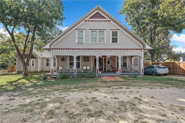 back of house featuring a porch