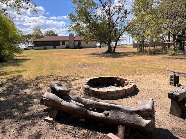 view of yard with an outdoor fire pit