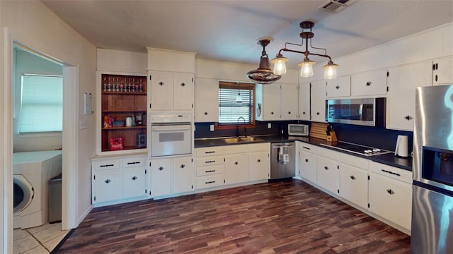 kitchen with white cabinets, stainless steel appliances, and sink