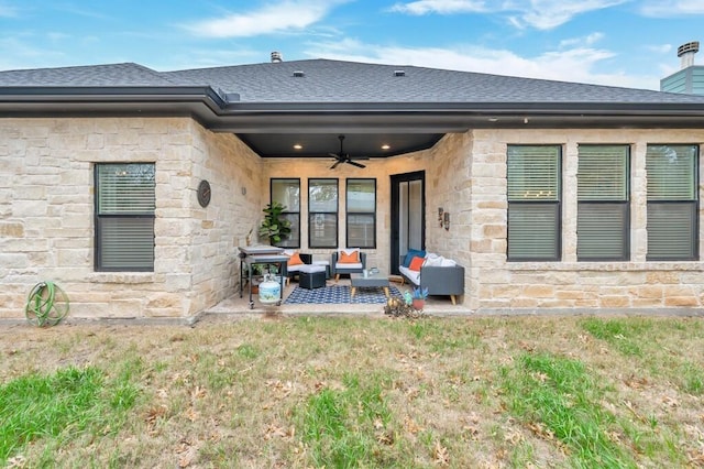 back of house featuring an outdoor living space, a yard, a patio, and ceiling fan