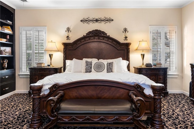 bedroom with carpet flooring and crown molding