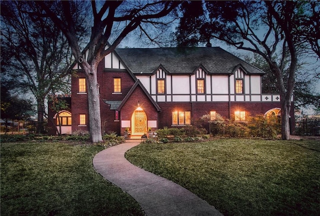 tudor house with a front lawn